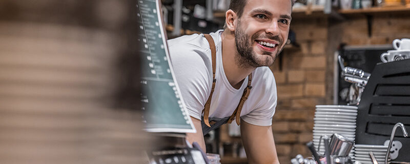 indoor-shot-of-happy-young-bar-owner-standing-at-t-2023-11-27-05-20-34-utc